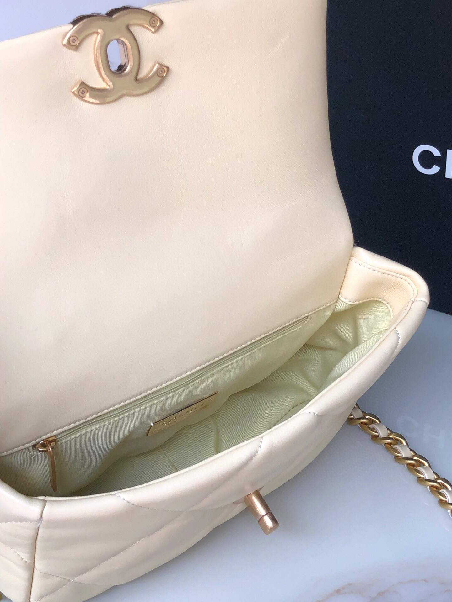 Ch*el 19 handbag shiny leather, gold-tone, silver-tone & ruthenium-finish metal dark yellow 6.2 × 10.1 × 3.5 in