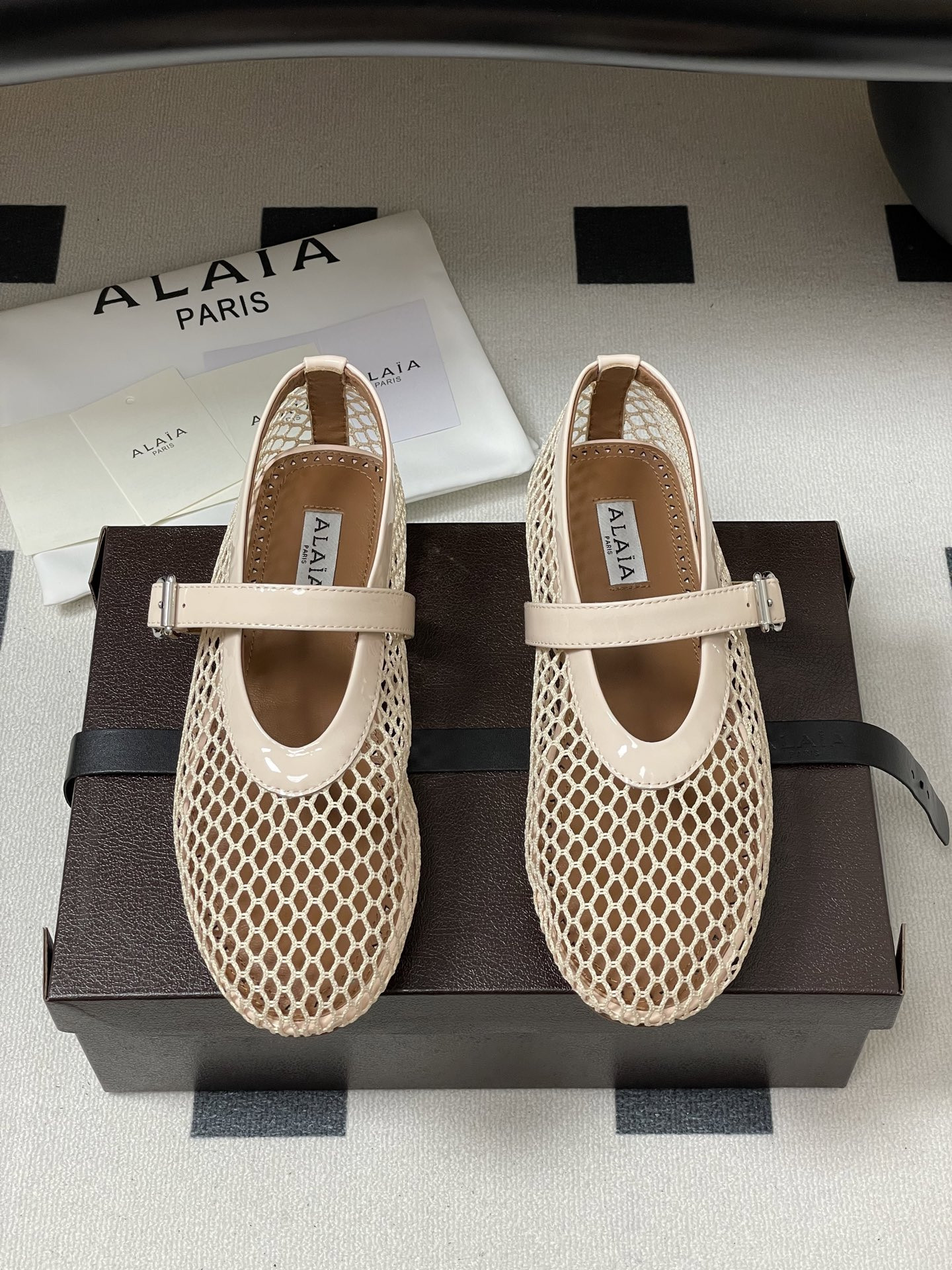 UA ALAÏA BALLET FLATS IN FISHNET